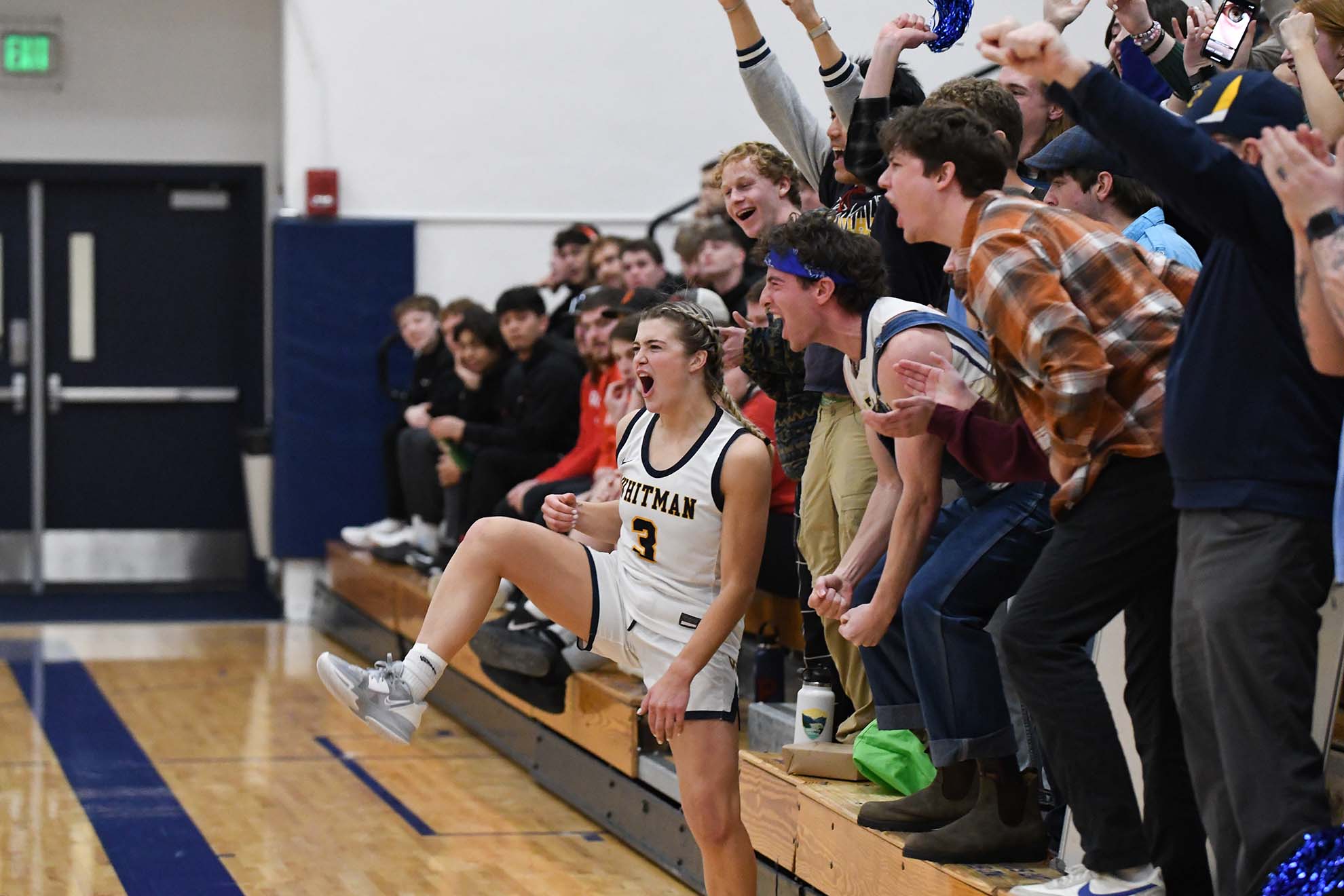 Fans cheering the Whitman Blues.