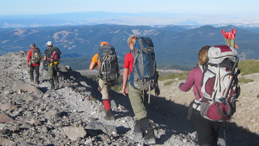 Hikers on mountain ridge.