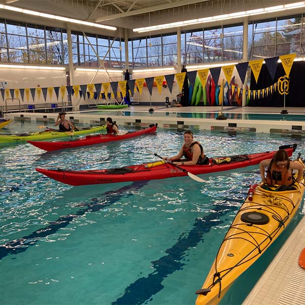 Kayak practice indoors in a pool.