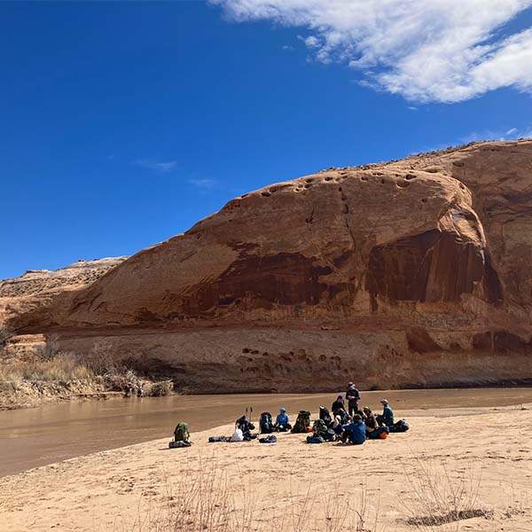 A group of outdoor students and leaders in the outdoors.