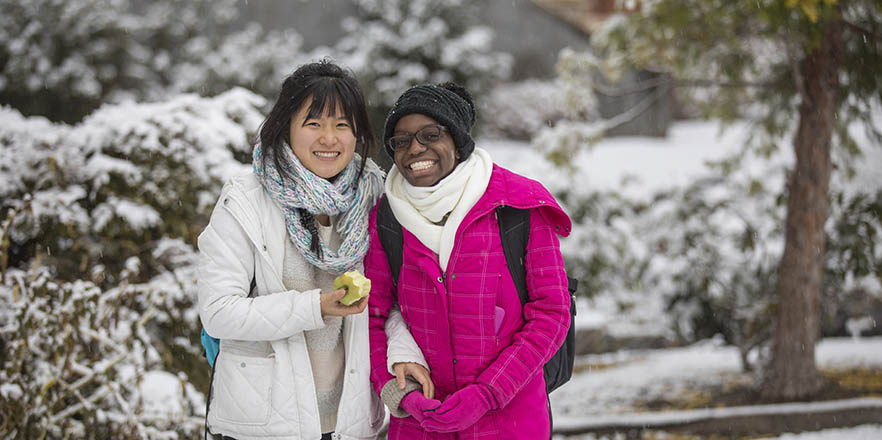 Two students posing in the snow