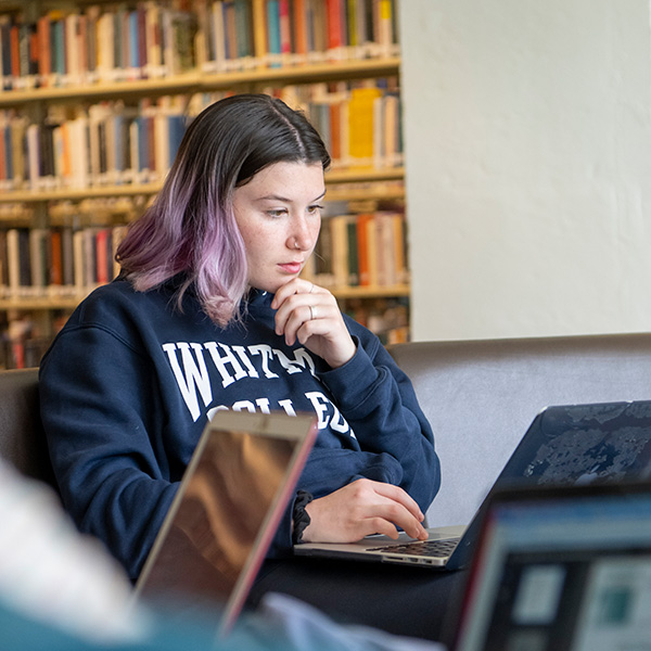 Whitman College student conducting a science experiment.