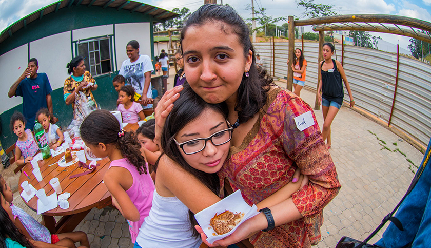 Ludmilia De Brito '18 hugs a friend during her internship at Incorporada RPF in São Paulo. 