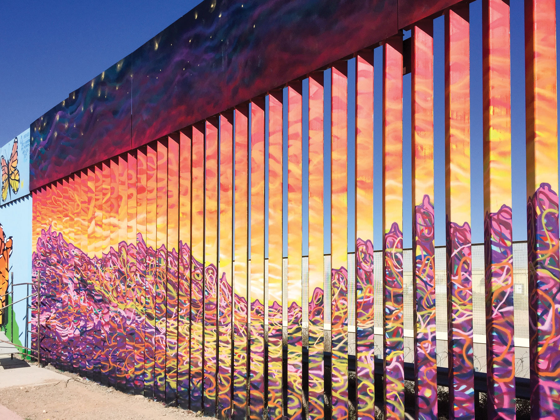 Colorful art painted on the border wall