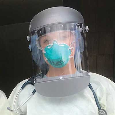 Whitman College Alumni healthcare worker wearing protective mask