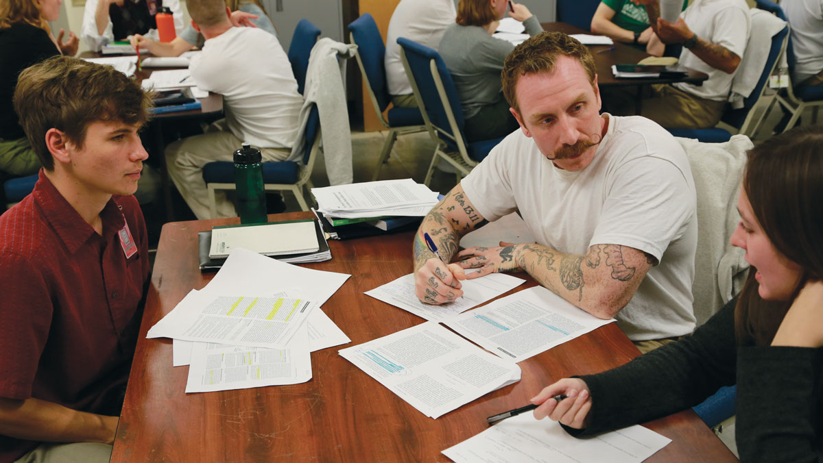 Whitman College students speak with a prison inmate