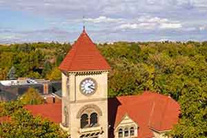 Aerial view of Whitman College's Memorial clock tower through the trees