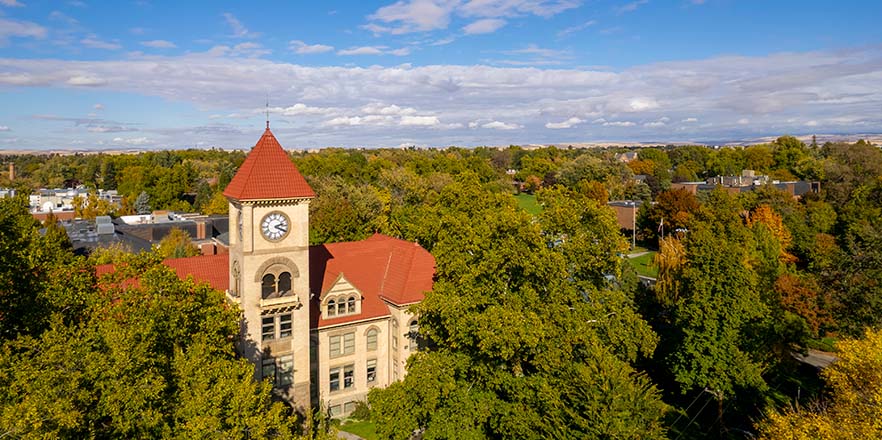 Aerial view of Whitman College's Memorial clock tower through the trees
