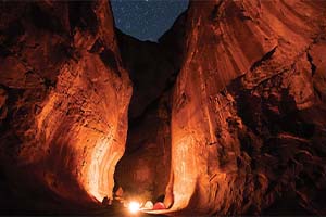 Campsite inside a cavern at night.