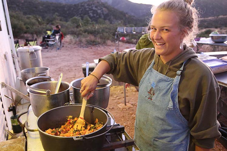 A Semester in the West student cooks while on the road.