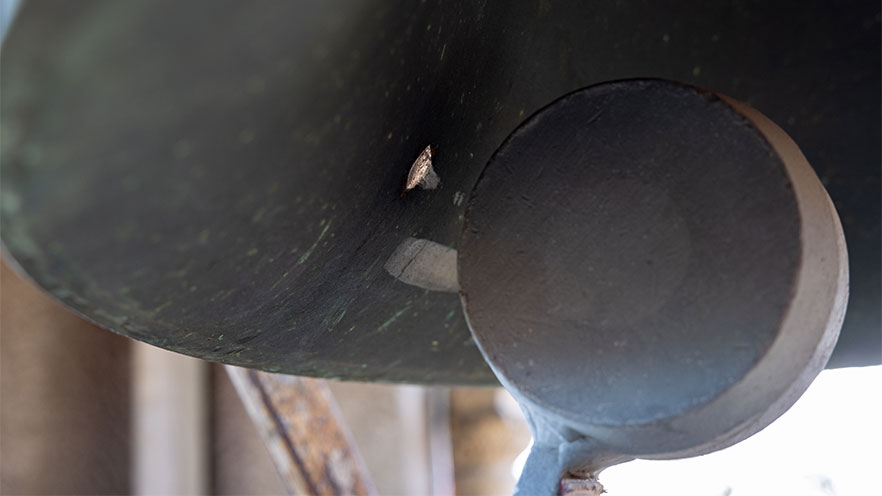 Clock tower bell hammer.