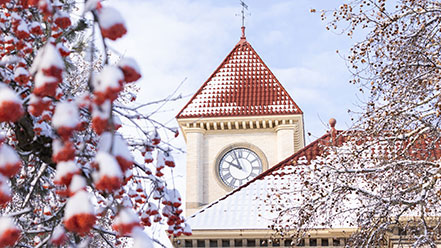 Memorial Building clock tower with snow falling.