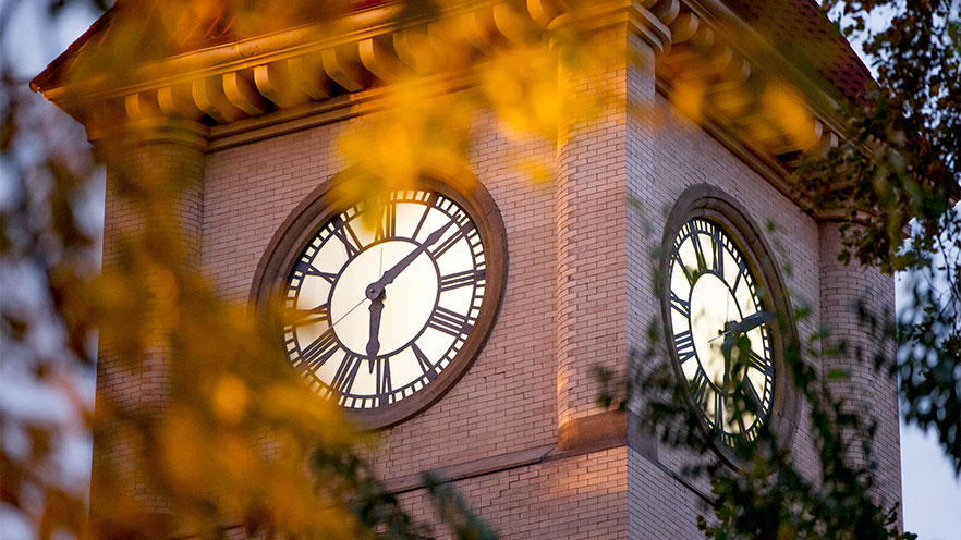Memorial Building clock tower at sunset.