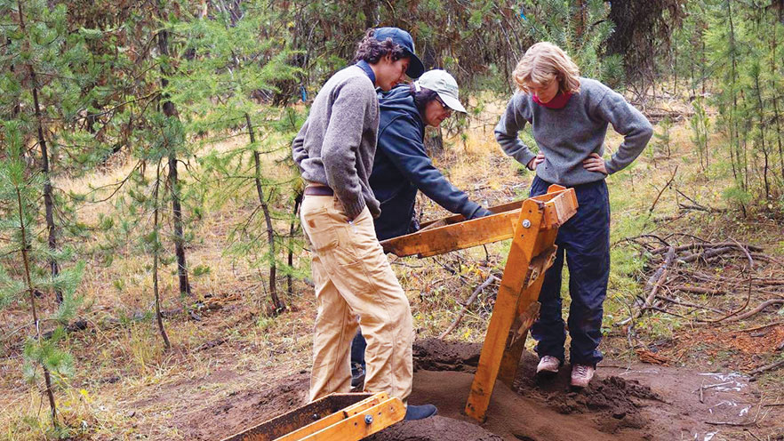 Students working on the soil.