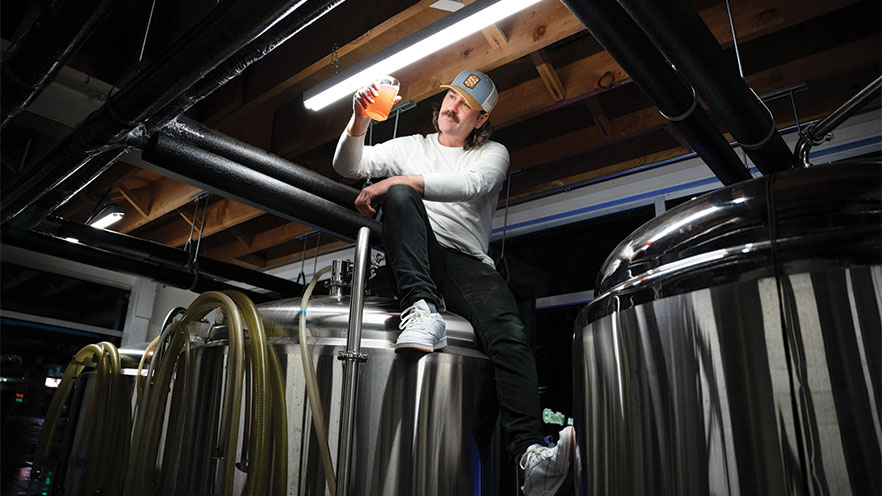Zachary Lough distilling cider.