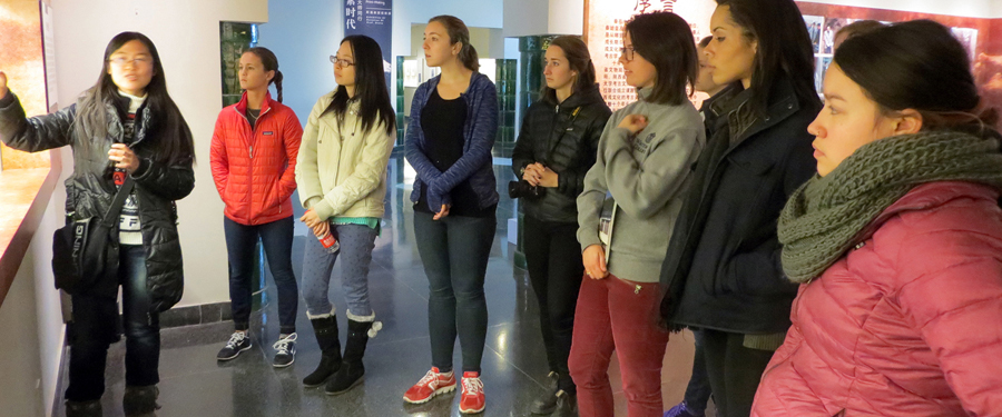 Students gathered around an exhibit