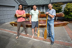 Nathan Dappen, far left, Alan Dappen and Andy Dappen stand with their canoes.