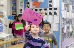 Children holding signs