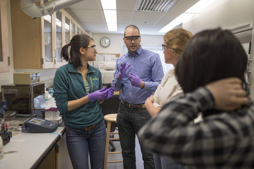 Nate Boland in the lab with students