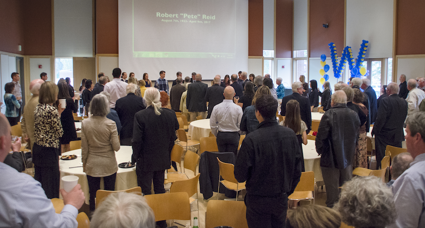 The Reid family offers a toast of their patriarch and a slideshow about him at the reception in the Young Ballroom of the Reid Campus Center, which was named after the deceased and his wife.