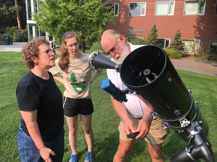 From left: Astronomy Department Chair Andrea Dobson ’82, astronomy and physics major Meghan Feldman ’18 and astronomy instructor Marty Scott from Walla Walla University prepare the telescope that will be publicly available for those seeking a safe, up-close look at the eclipse.