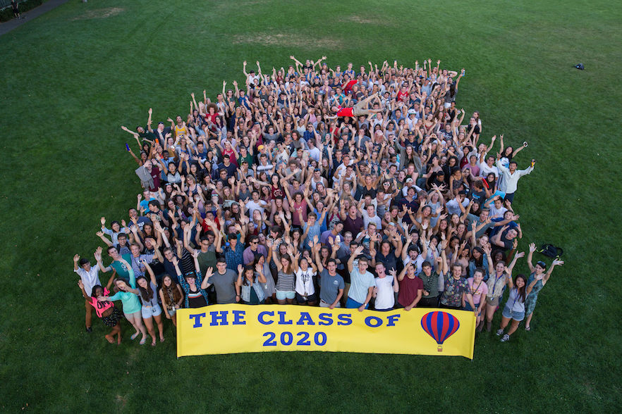 Class of 2020 celebrating on Ankeny Field with banner