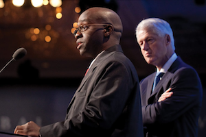 Ashifi Gogo speaks at the Dartmouth Innovation Program as former President Bill Clinton observes. Photo courtesy the Clinton Global Initiative.