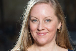 Close up head shot of a woman with blond hair