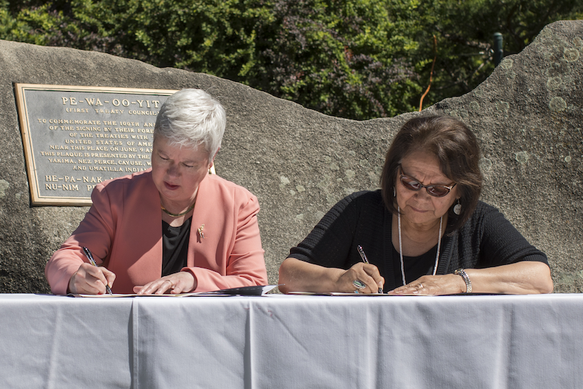 Murray and Kathryn Brigham, secretary of the CTUIR Board of Trustees, sign the document.