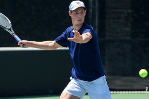 Zach Hewlin serves the ball