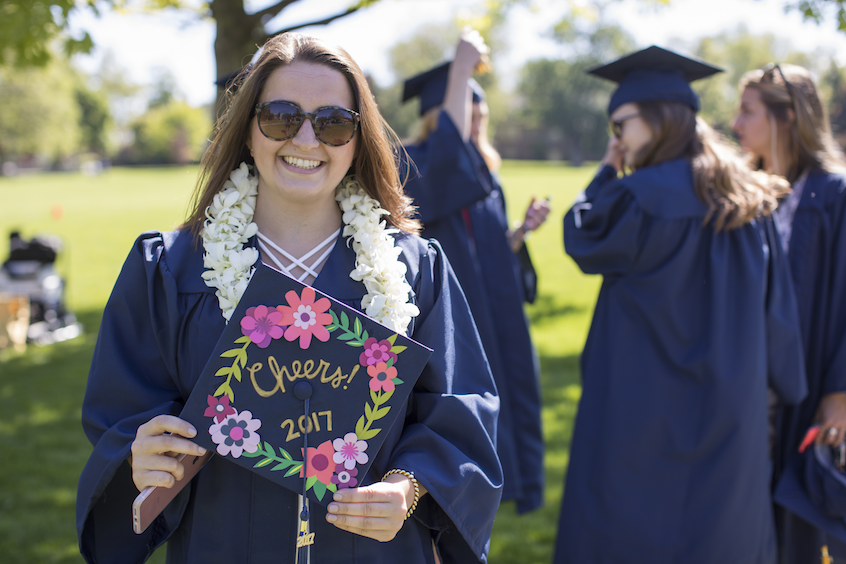 Emily Volpert with cap decorated to say "Cheers!"