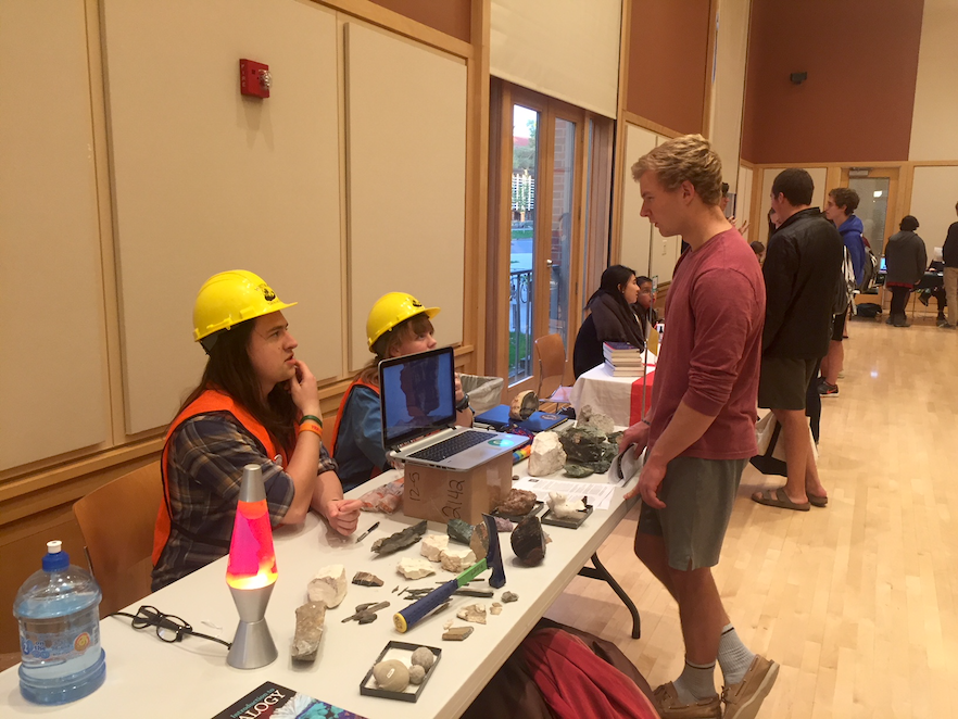 Chemistry and geology major Bryce Benson ’18 (left) and geology major Molly Coates ’17 represent the geology department at last year’s fair. Photo by Nora Leitch '18. 