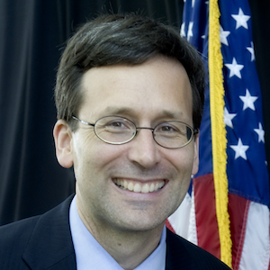Bob Ferguson with flag in the background