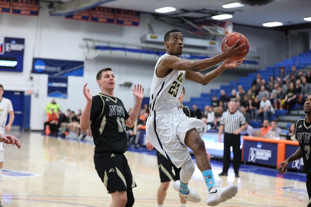 Basketball player goes up for a shot