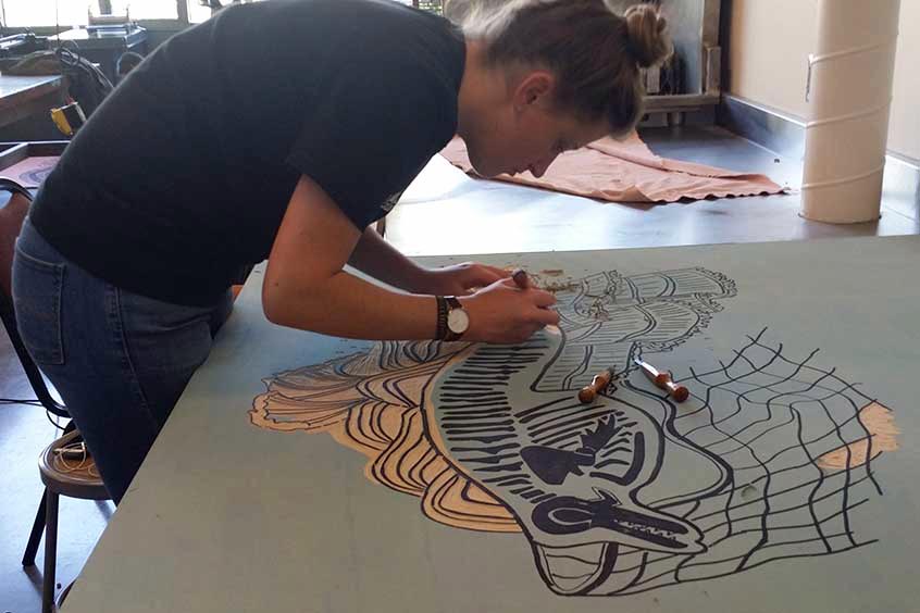 Student carving woodblock