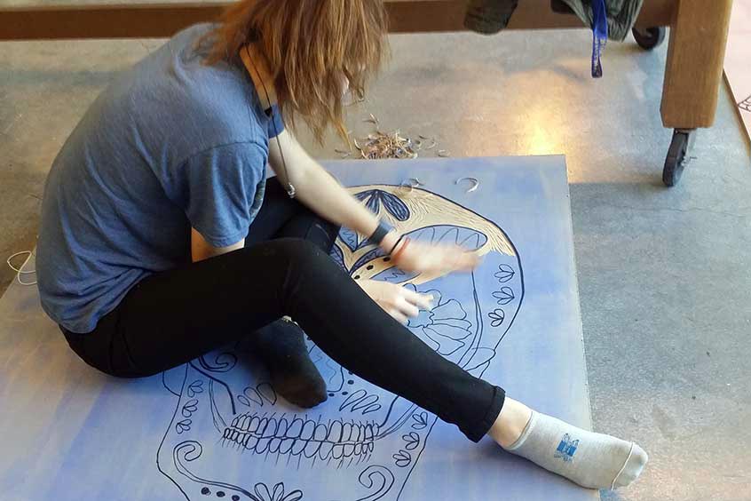 Student carving woodblock