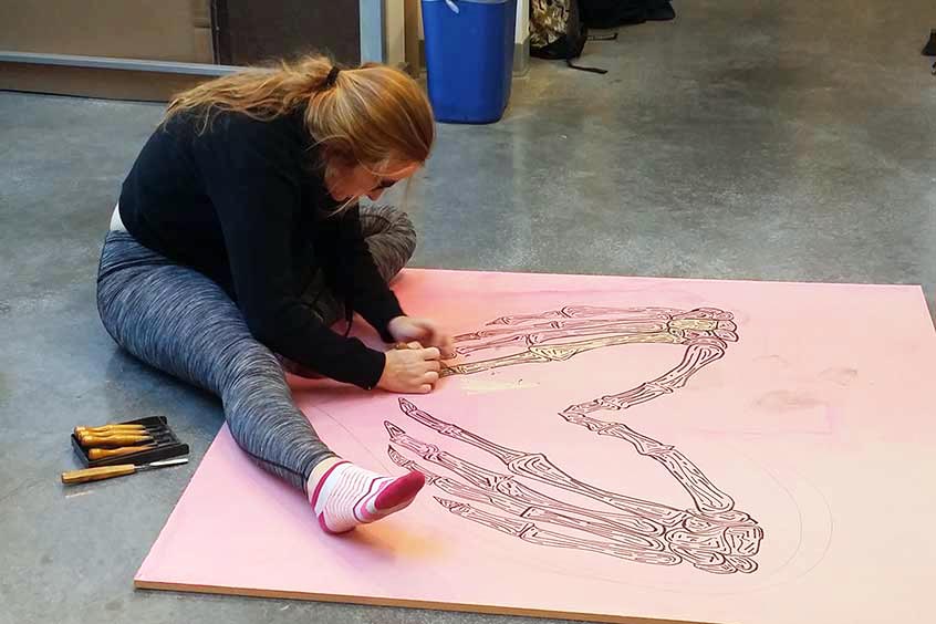 Student carving woodblock