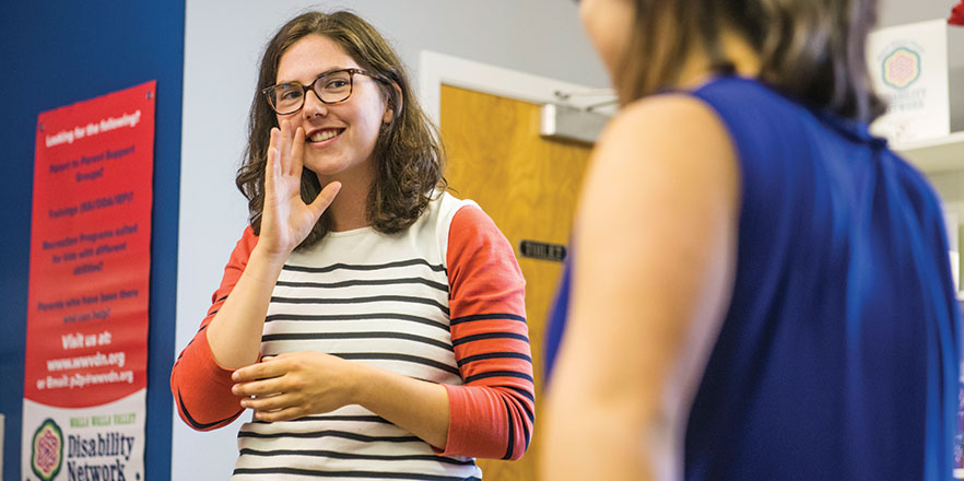 Emily Rigsby works with a student at the Walla Walla Symphony's Rock Camp.