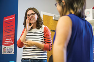 Emily Rigsby works with a student at the Walla Walla Symphony's Rock Camp.