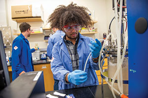 A student researcher works in a lab.