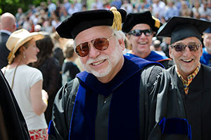 Keith Farrington smiles in the commencement line.