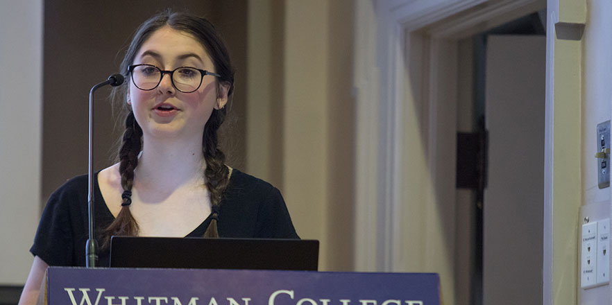 Hannah Ferguson speaks at a podium.