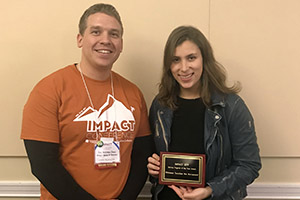 Maddy Gold '19 accepts the 2019 IMPACT Service Program of the Year award.