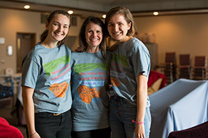 Olivia Hagmann, far right, stands with instructor Suzanne Morrissey, center, and another student.