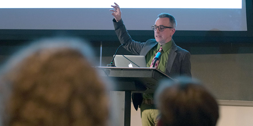 Peter Hobbs gives a lecture at a podium.