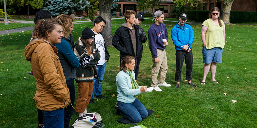 Heidi Chapin instructs a class in in how to do scientific illustration on Ankeny Field. 