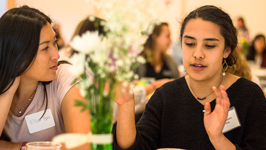 Zidane Galant La-Porte talks with another student at dinner.