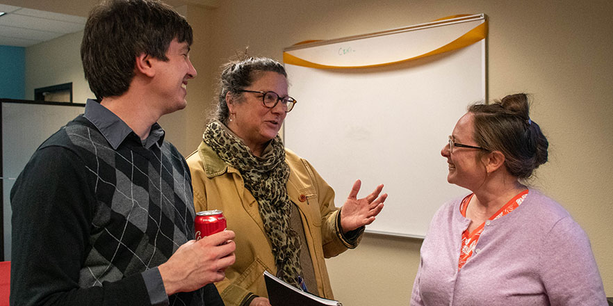 Associate Professor John Stratton, from left, Walla Walla Community Council Executive Director Mary Campbell, and Associate Professor Janet Davis talk during the open house for the WINcubator.
