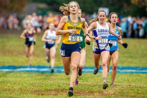 Whitney Rich runs in the cross country championships.