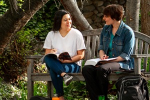 Whitman College student and faculty having a conversation outdoors